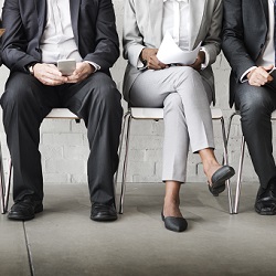 Image of individuals waiting for an interview 